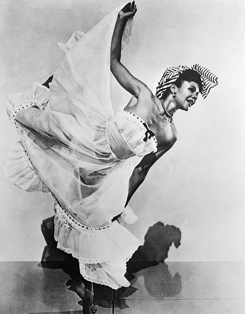 Katherine Dunham dancing in flowing white dress